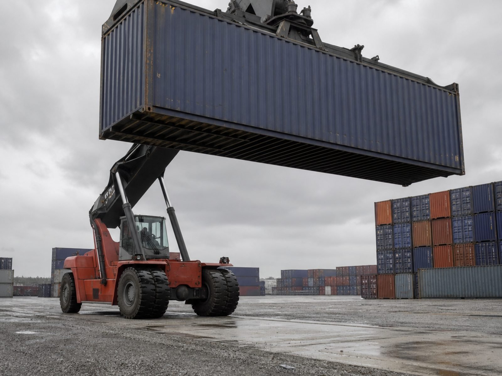 The BFact Units yard, with a reach stacker lifting a 40ft unit